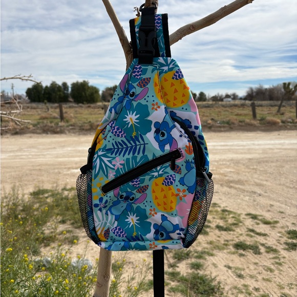 Disney Handbags - Sling bag stitch Disney crossbody backpack